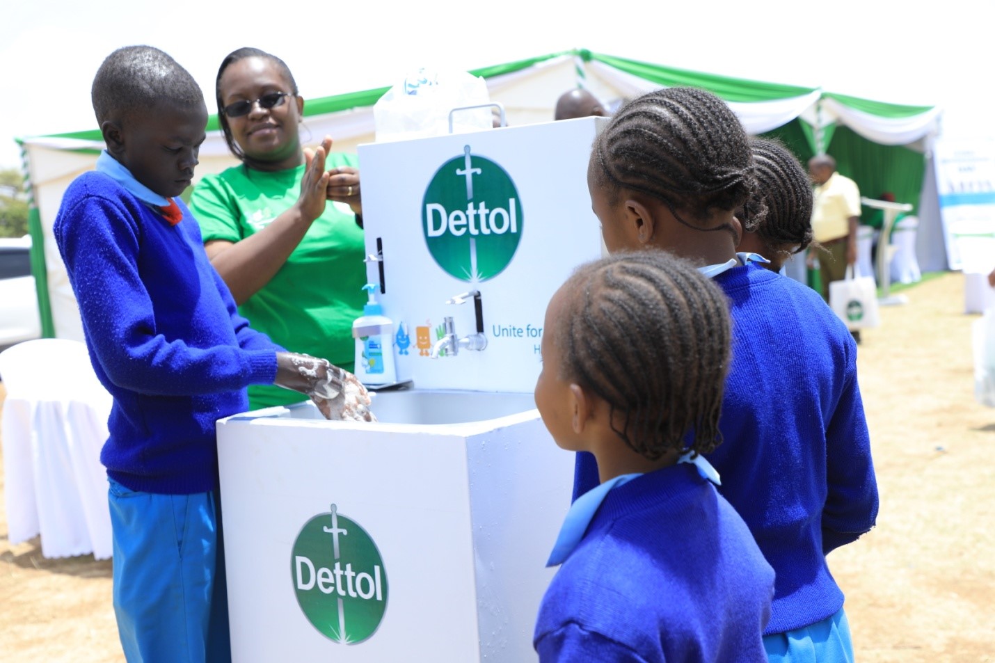 Reckitt Senior Brand Manager Margaret Ngea teaches pupils of Kasarani Primary School on hand washing techniques as world marked Global Hand Washing Day. Dettol School Hygiene Program has reached 2 million school going children.