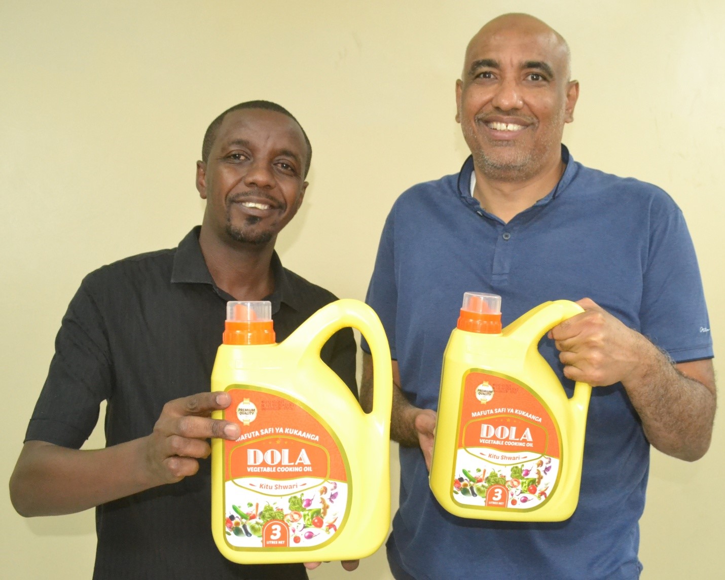 Kitui Flour Mills Finance Director Anwar Bajber and with Dola’s Shaaban Said during the launch.