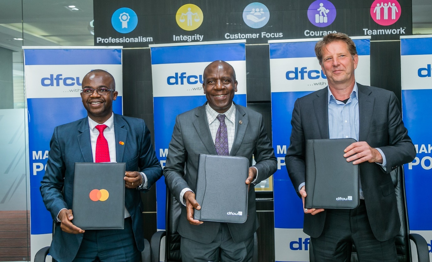 (L-R): Daniel Huba, Vice President of Sub-Saharan Africa Market Development for Community Pass at Mastercard; Charles Mudiwa, Chief Executive Officer and Managing Director of dfcu Bank; and David Gerbrands, Global Head of Agri and Banking Advisory Services and Inclusive Business Ventures at Rabo Partnerships, signing the partnership agreement in Uganda.