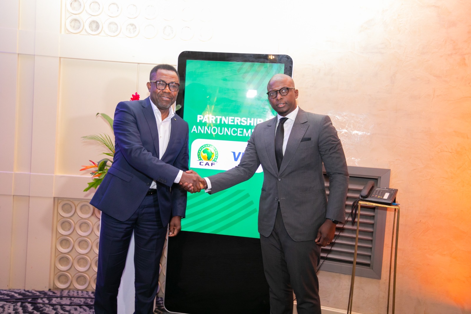 Ismahill Diaby, Vice President, Cluster Country Manager, Visa Western and Central Africa (Right) and Véron Mosengo-Omba, General Secretary of Confederation of African Football (CAF) during the signing ceremony in Abidjan
