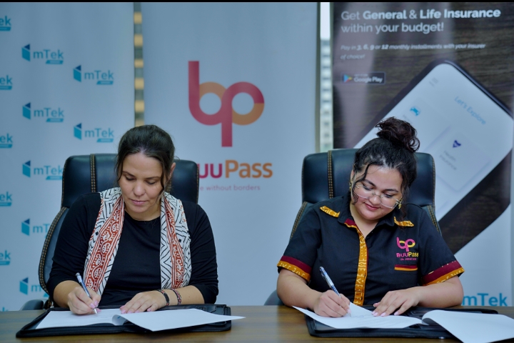 L-R: mTek CEO Bente Krogmann and Buupass CEO Sonia Kabra during an MoU partnership signing to provide Travel Insurance cover for travellers.