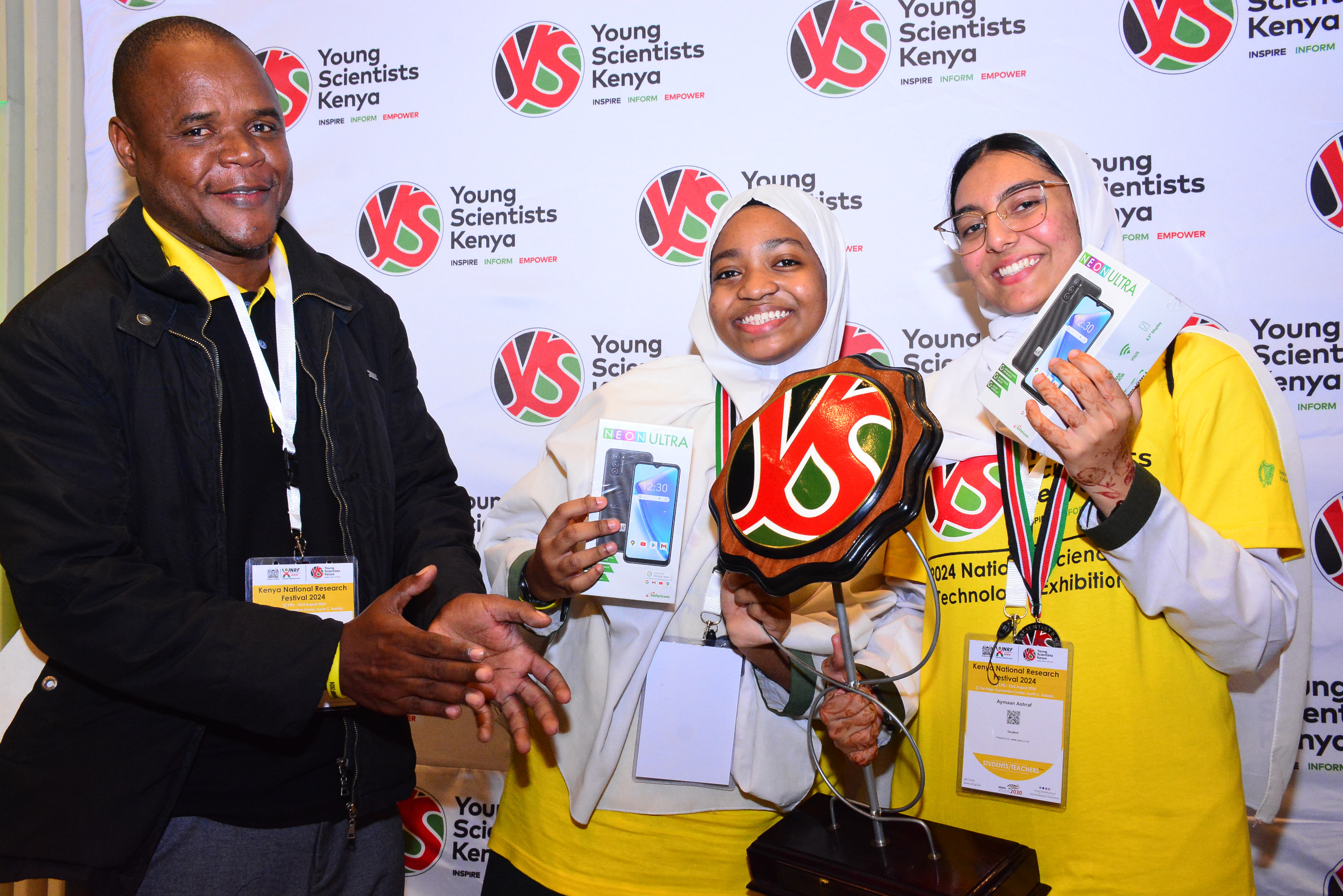 L-R Mr. Josephat Mzikali, Marithiya Issa and Aymaan Khandwalla of Memon Academy High School in Mombasa after emerging runners up of the 7th Edition of the Annual Young Scientists Kenya [YSK] National Science and Technology Exhibition