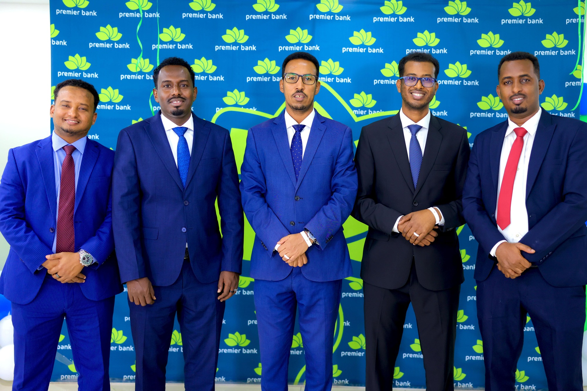 Premier Bank’s leadership team during the launch of the Tap2Pay NFC Wearable payment solution in Mogadishu, Somalia, on October 8, 2024. From left to right: Mahad Ahmed, Head of Operations; Mohamed Ali, Corporate Banking Relations Manager; Ahmednur Mohamed, Head of Public Relations; Abdishakur Afrah, Head of Business; and Zakaria Ahmed, Card Operations Manager.